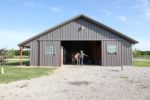 A Complete Metal Building Home with a Pool and a Stable