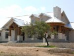 One of a Kind Ranch House with Steel Roof & Wrap-Around Porch