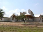 One of a Kind Ranch House with Steel Roof & Wrap-Around Porch