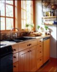 Peer into this 400-square-foot cabin's sunny kitchen ...