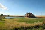 Great Barn Home Features an Open Wrap Around Porch